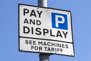 A Pay and Display Parking Sign.
